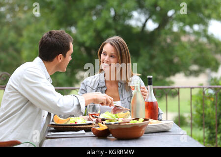 https://dttx.qbu.edu.vn/wp-content/uploads/sites/50/2023/05/cheerful-couple-having-lunch-in-hotel-garden-kgrrmw.jpg